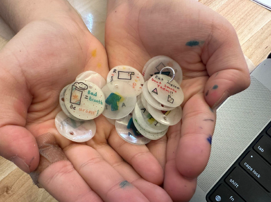 A person holding a pile of small round objects AI-generated content may be incorrect.