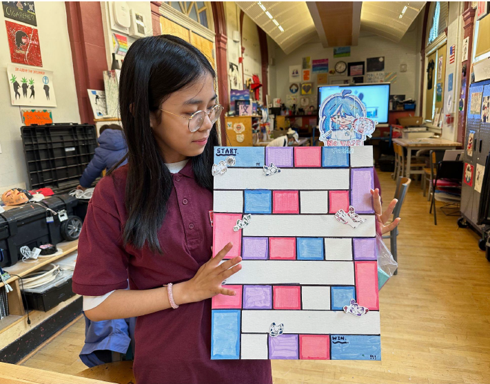 A child holding a piece of paper AI-generated content may be incorrect.